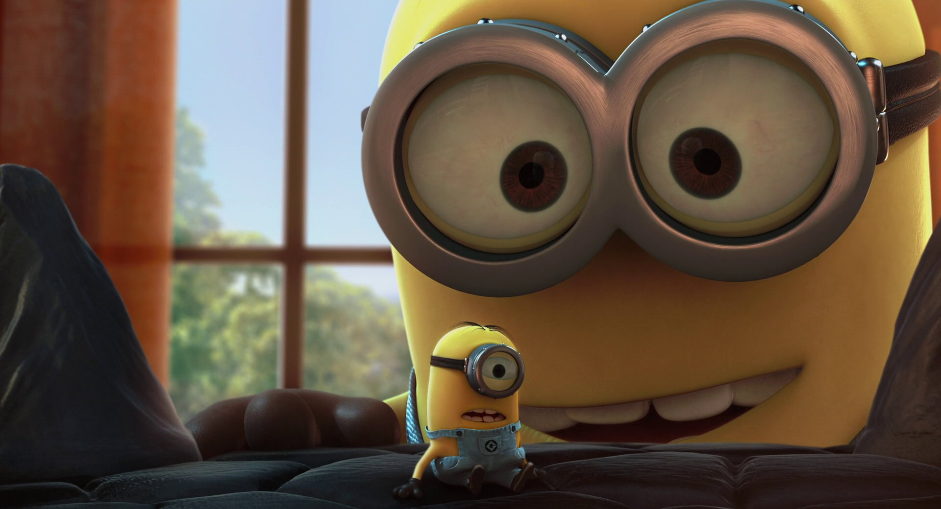 Close-up of a Minion with a smaller Minion in the foreground, from the movie Despicable Me