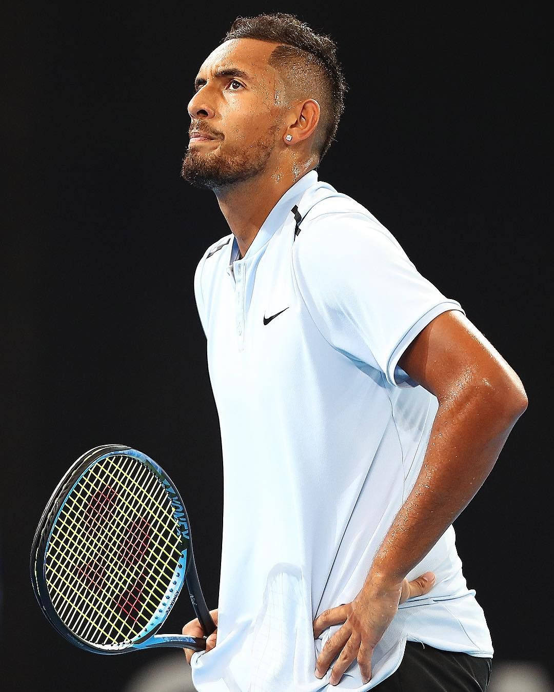 A Tennis Player Holding Racket Wallpaper
