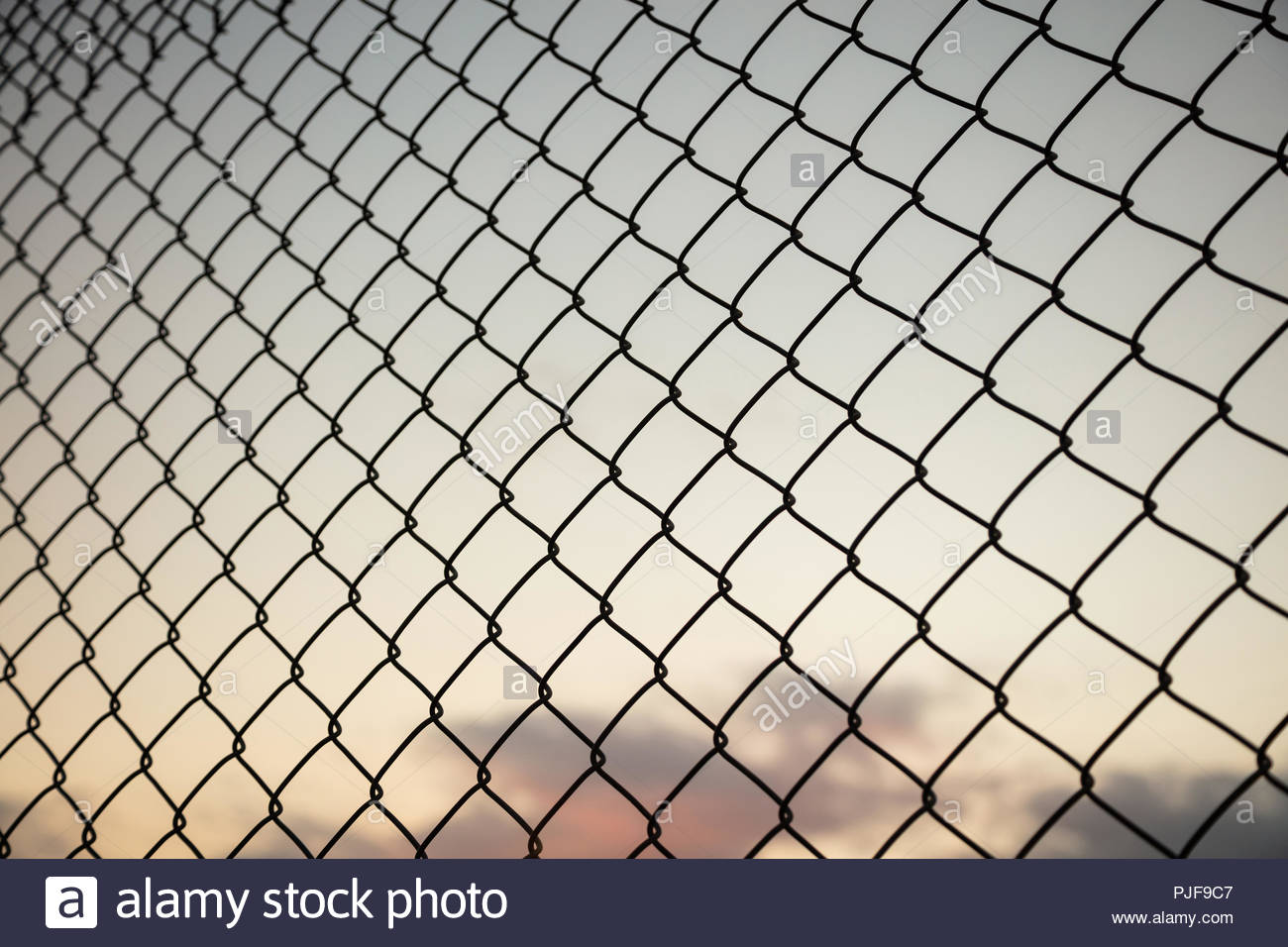 Sky Through Wire Mesh Fence Blur Background Close Up Of