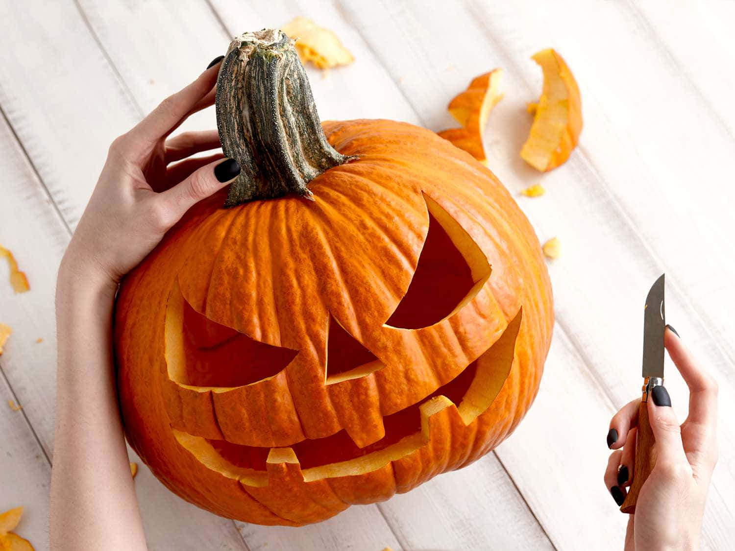 Get Ready For Halloween With This Creative Pumpkin Carving Wallpaper