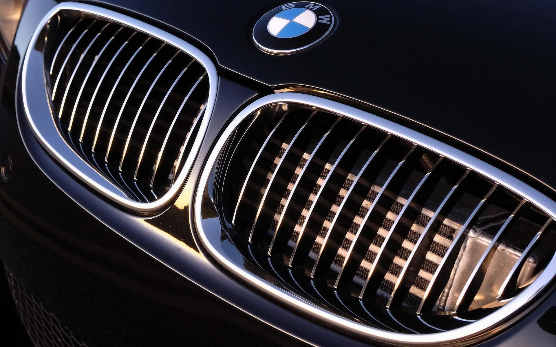 Close-up of a BMW logo and grill on a black car