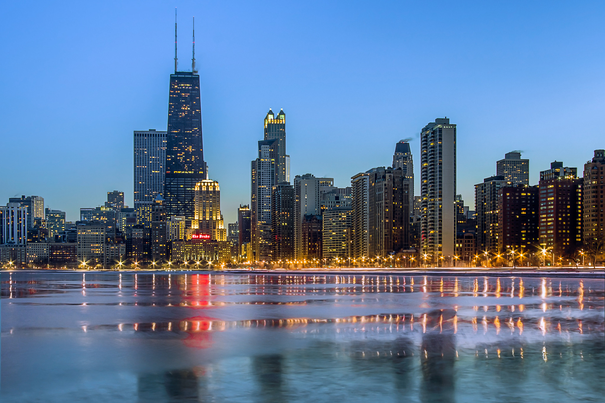 Stunning Chicago skyline at dusk reflected in the icy waters of Lake Michigan