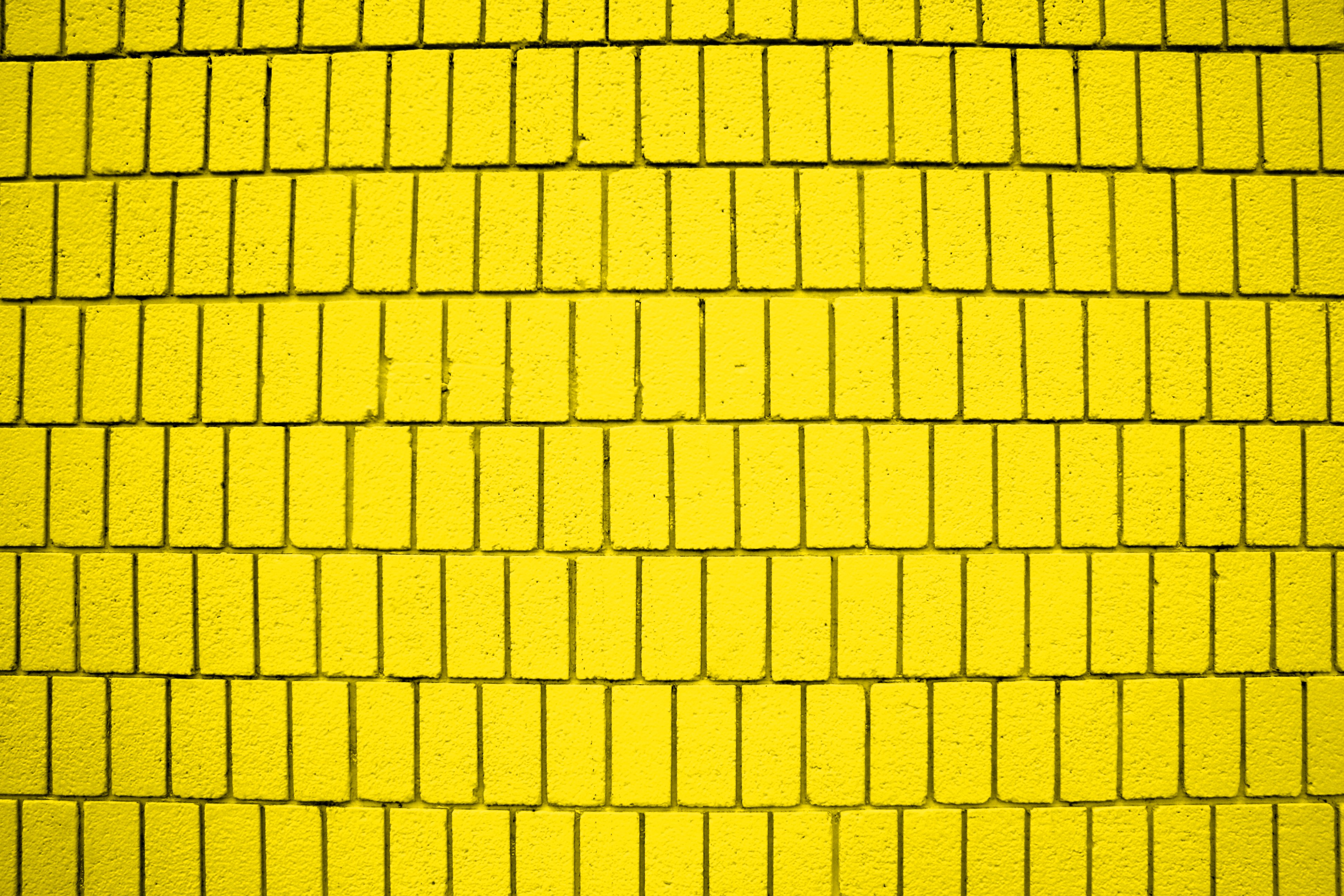 Bright Yellow Brick Wall Texture With Vertical Bricks Picture