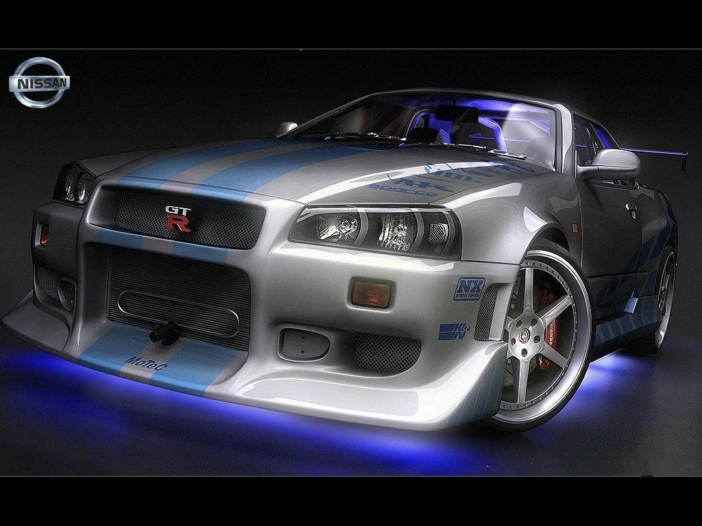 Nissan Skyline GT-R R34, a silver and blue sports car, against black background