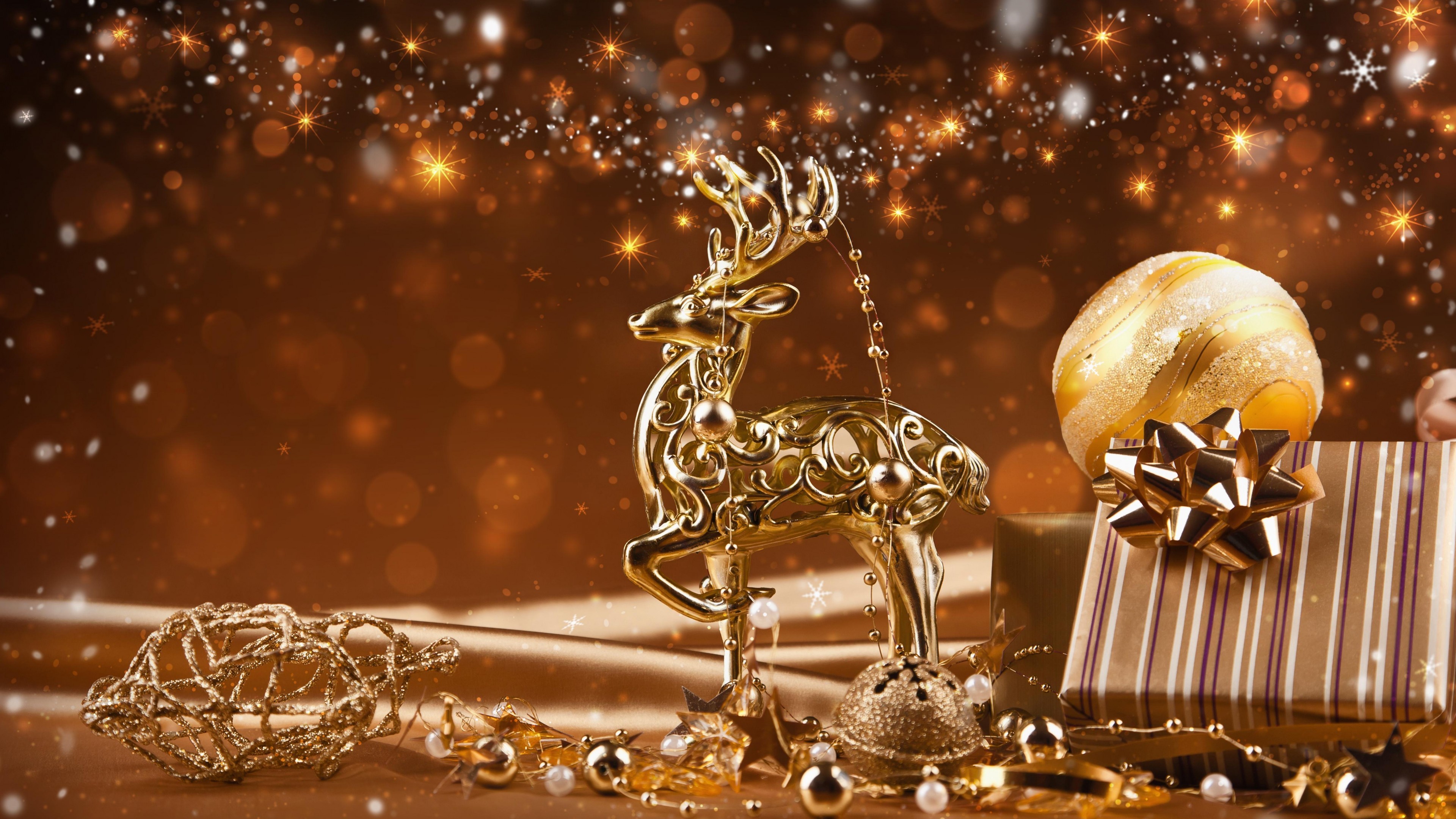 Golden Christmas decorations on a shimmering background, evoking a preppy and festive holiday scene