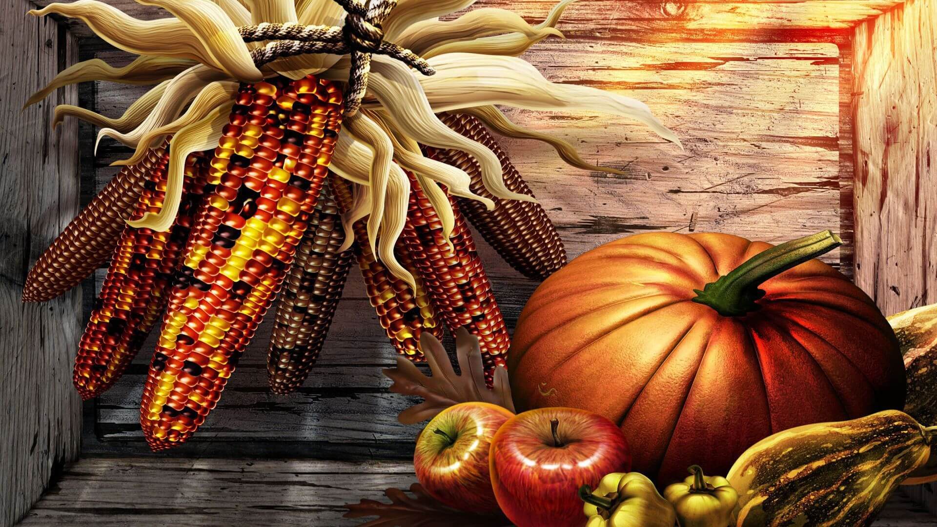 A beautiful Thanksgiving still life with pumpkins, corn, apples, and gourds