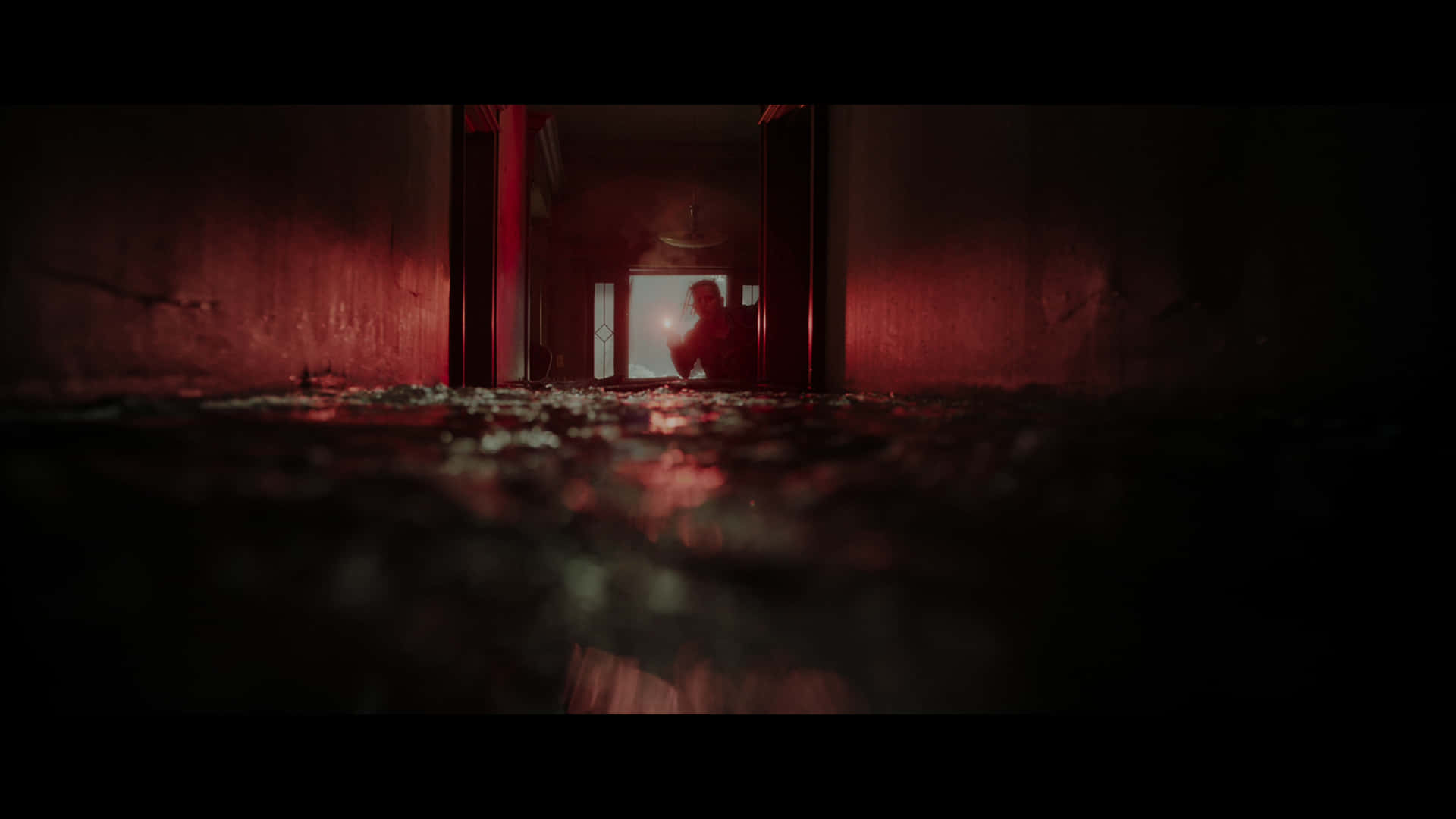 Eerie Hallway Figure Wallpaper