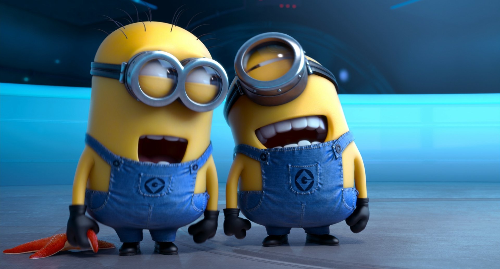 Two Minions laughing hysterically in a scene from Despicable Me