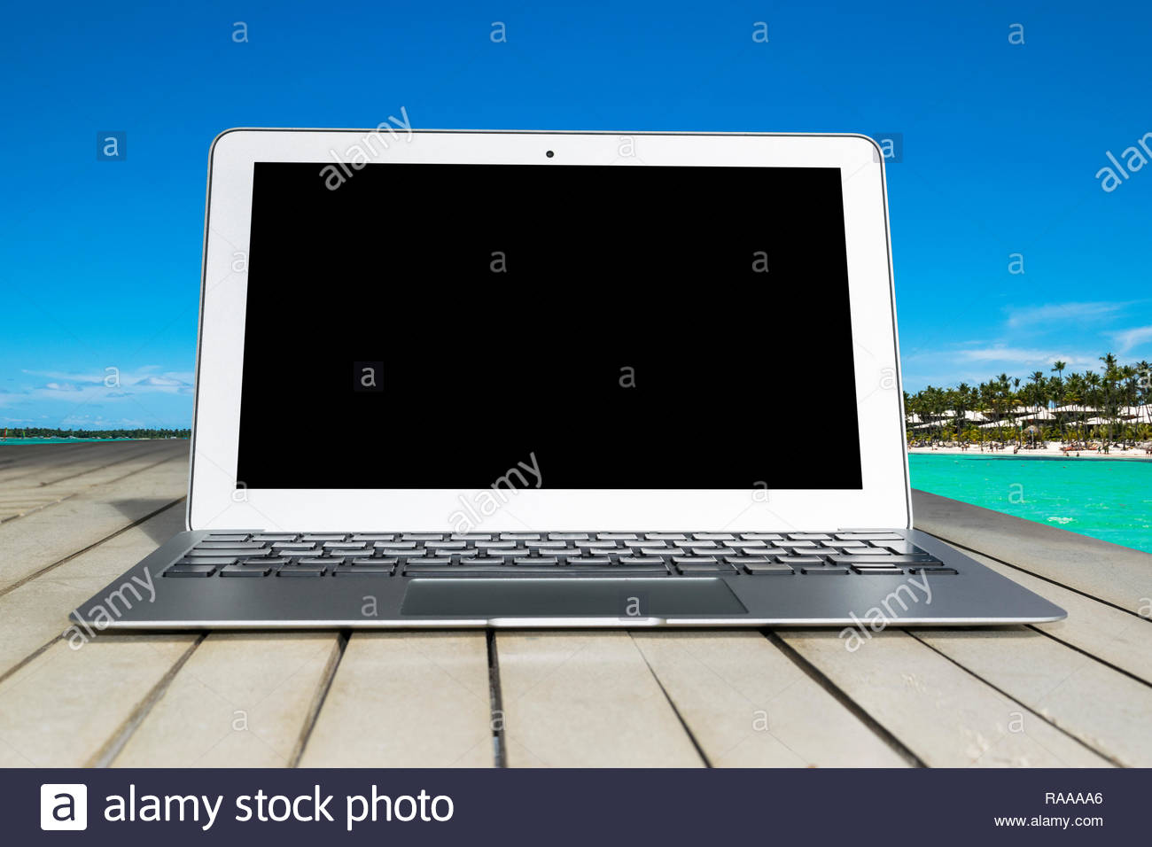 Laptop Puter On Wooden Table Top Ocean Tropical Island