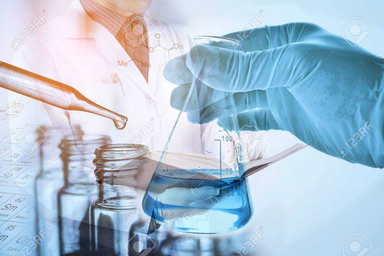 Laboratory Glassware With Scientist Background Stock Photo