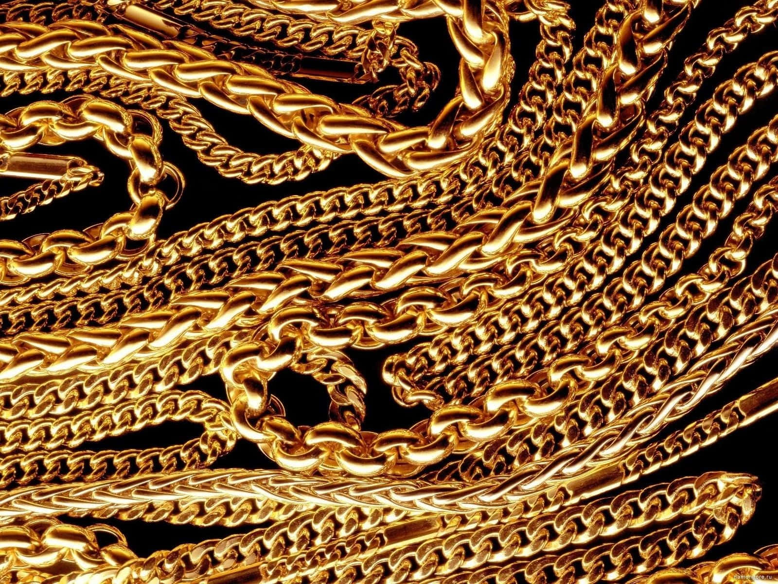 A Bunch Of Gold Chains On Black Wallpaper
