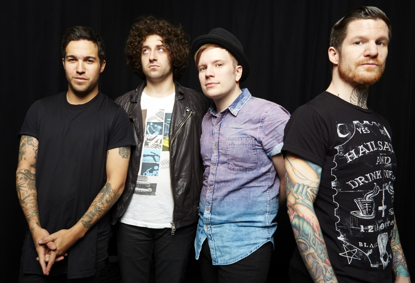 A promotional photo of the band Fall Out Boy, featuring all four members: Patrick Stump, Pete Wentz, Joe Trohman, and Andy Hurley