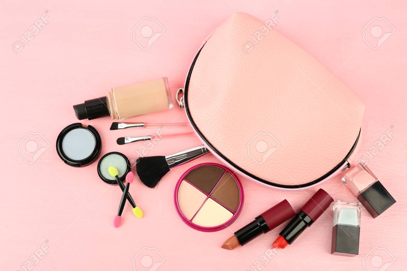 Makeup Set With Beautician Brushes And Cosmetics On Pink