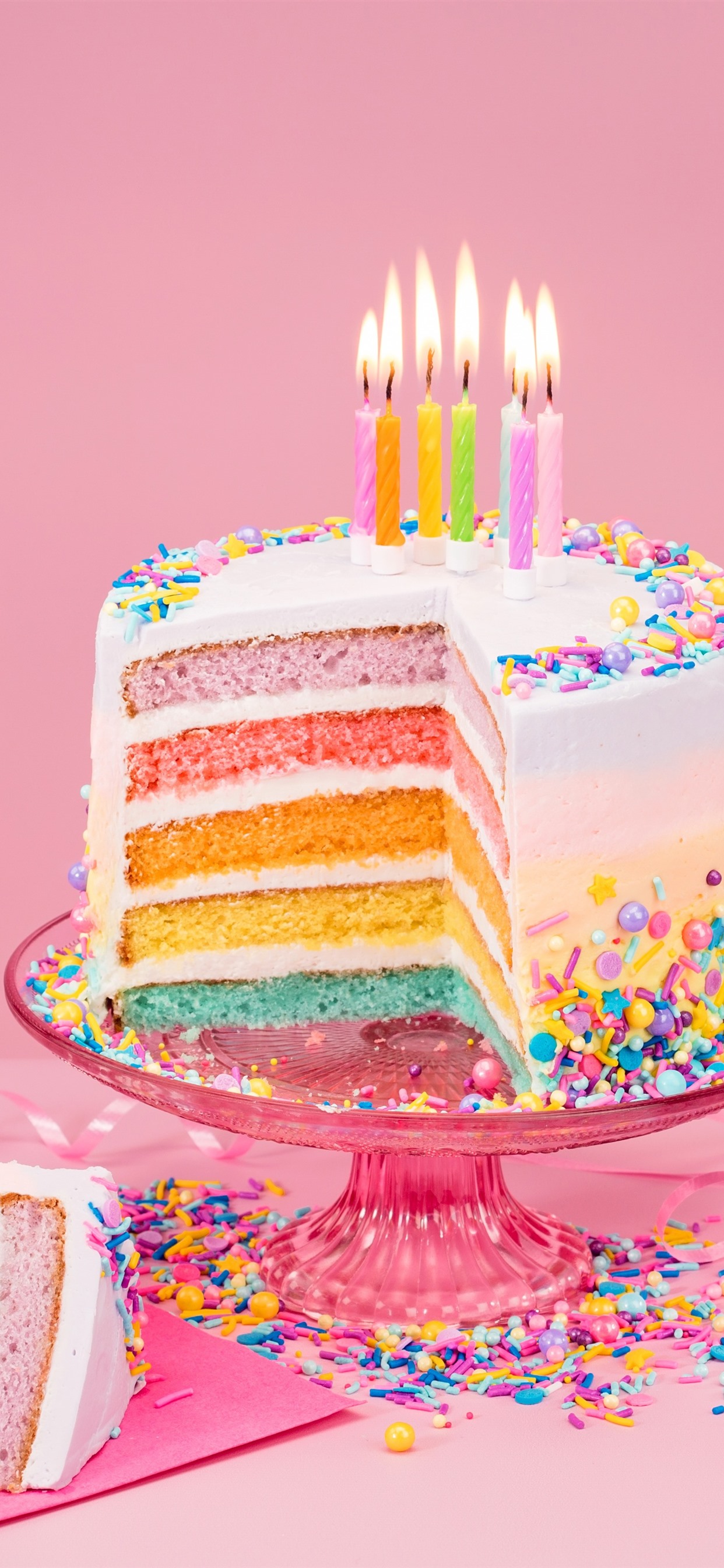 Birthday cake colorful layers rainbow color candles flame