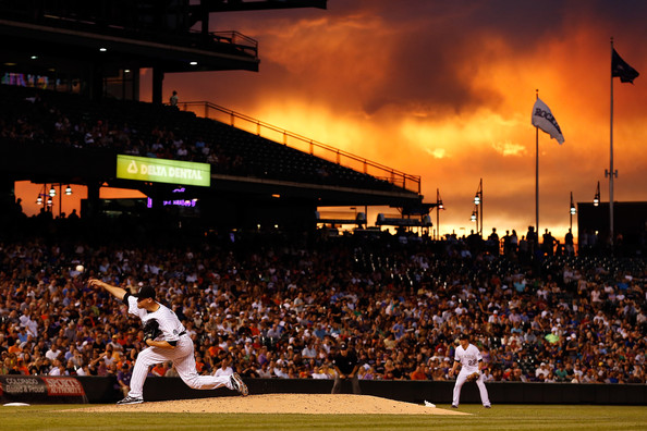 San Francisco Giants As Sunset Falls Over The Stadium At Coors Field