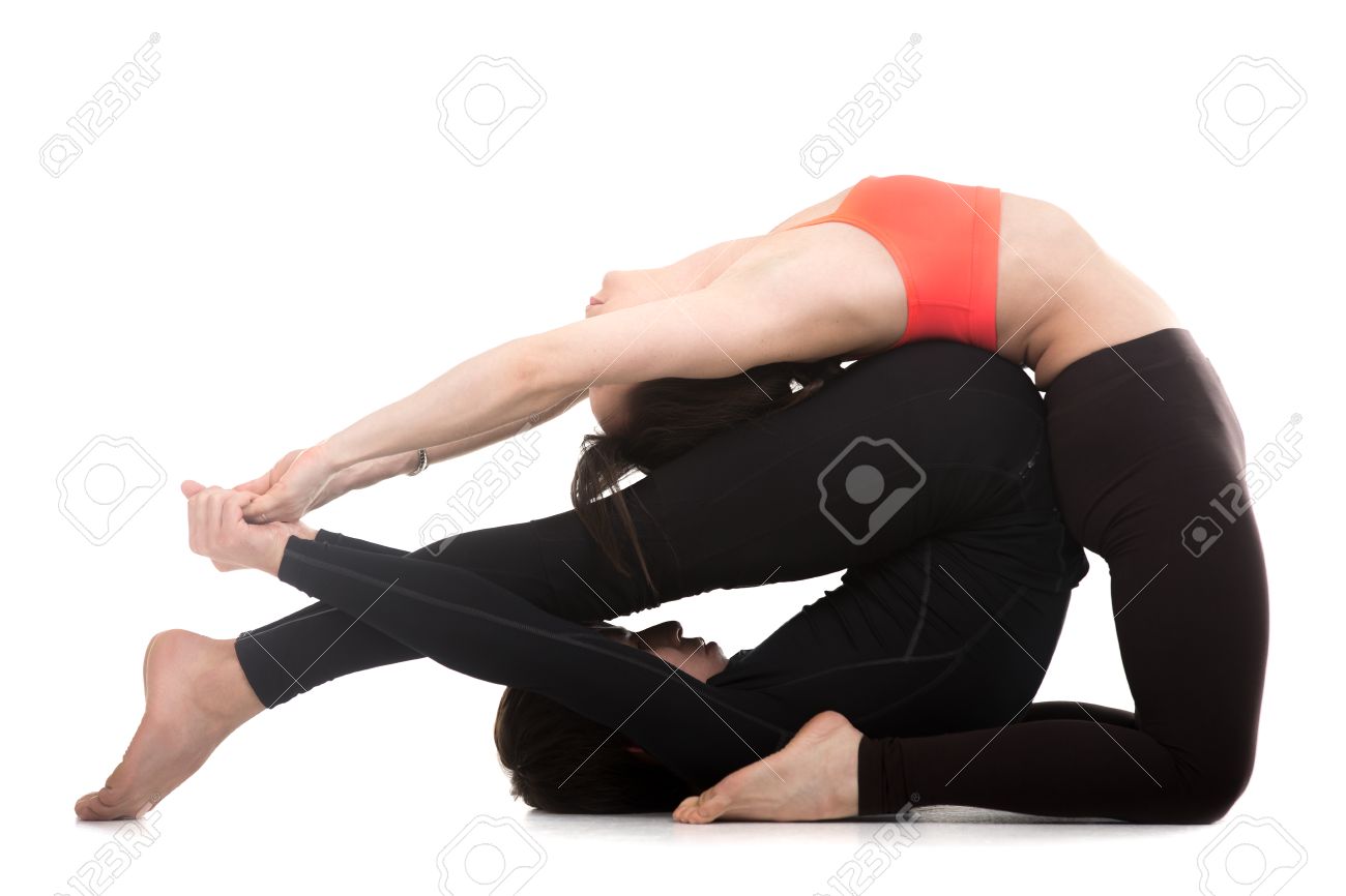 Sporty Couple On White Background Doing Acroyoga Fitness Or
