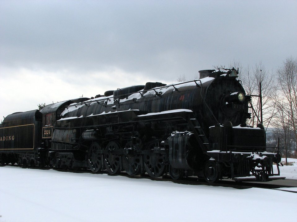 Train Stock Photo A steam locomotive under a stormy winter 958x719