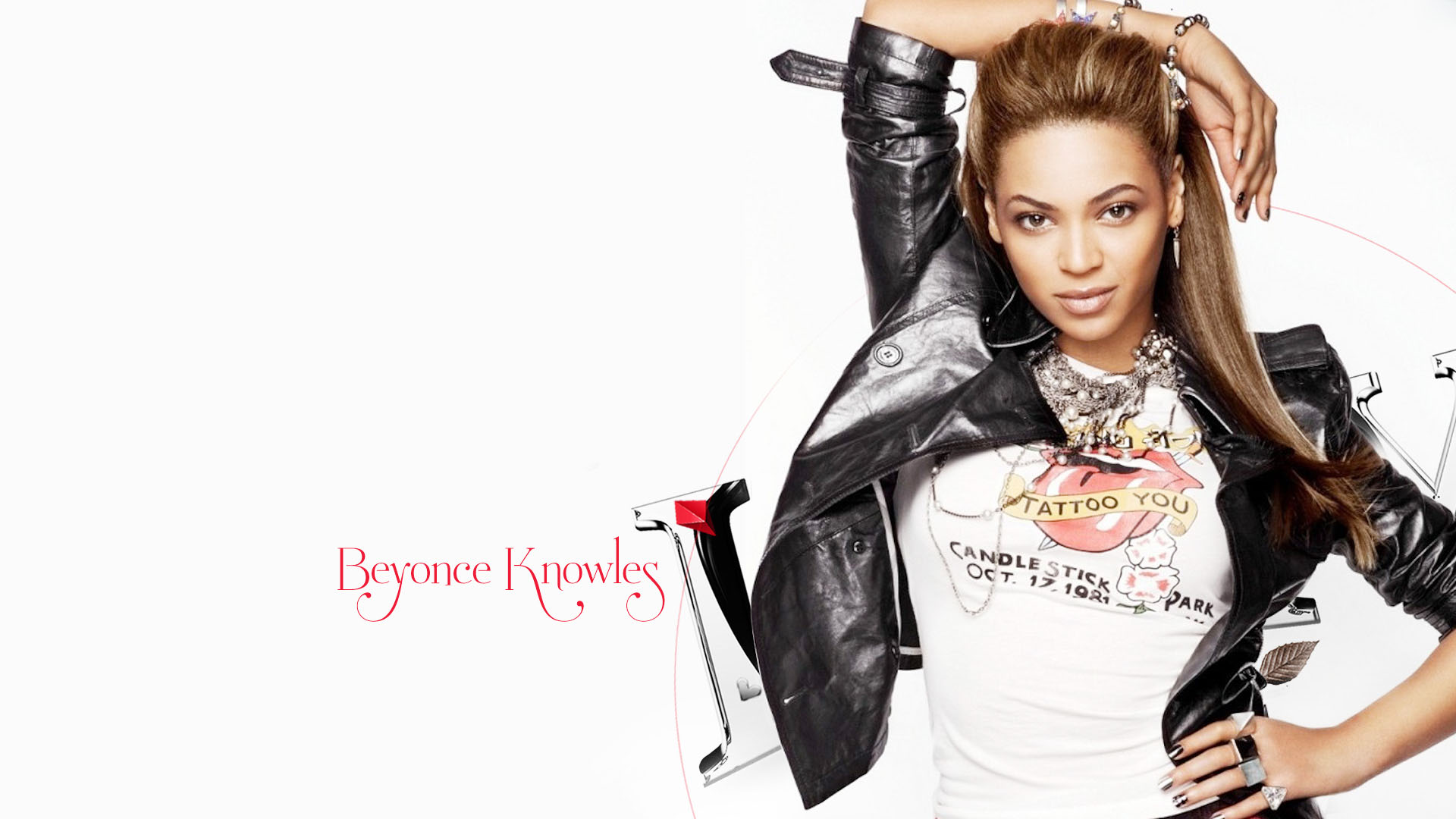Beyoncé Knowles in a stylish pose, wearing a black leather jacket and a white t-shirt