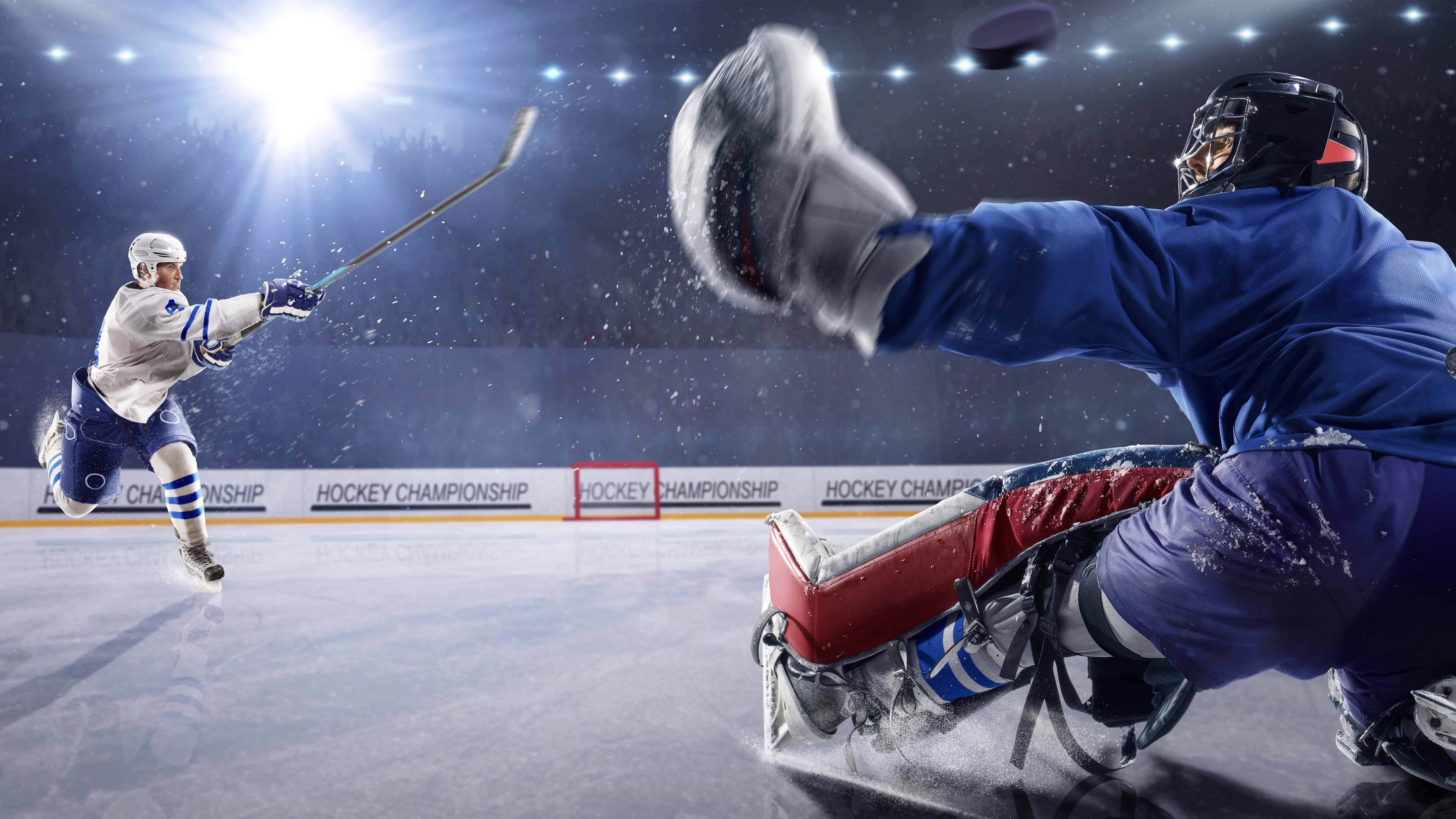 Hockey Player Shooting Puck At Goalie UHD 8k Wallpaper