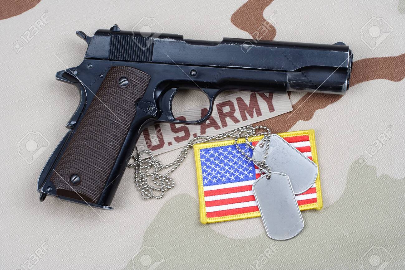 Colt Government With U S Army Uniform Background Stock Photo
