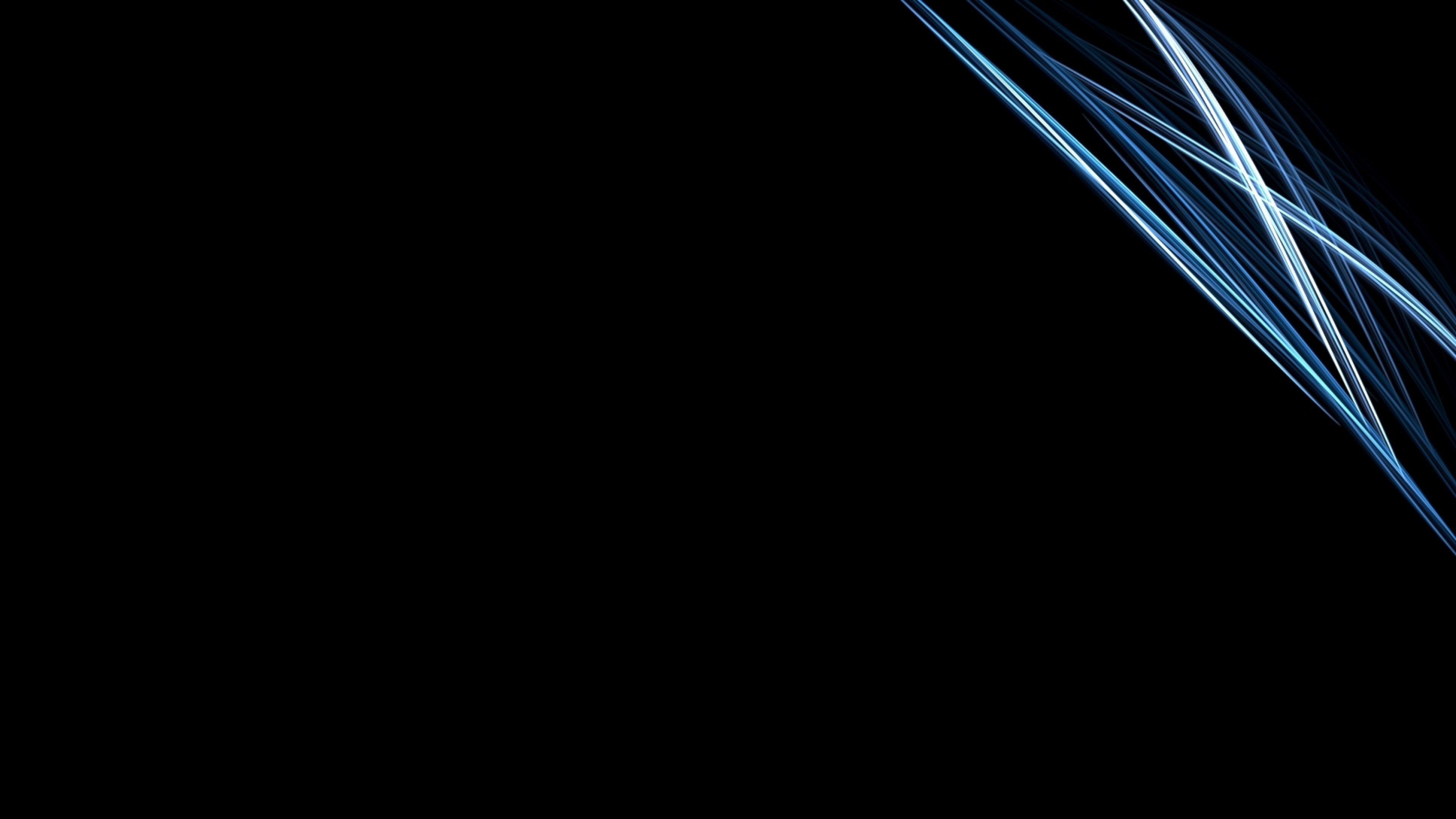 Abstract blue streaks of light on a black background, creating a cool and dark wallpaper