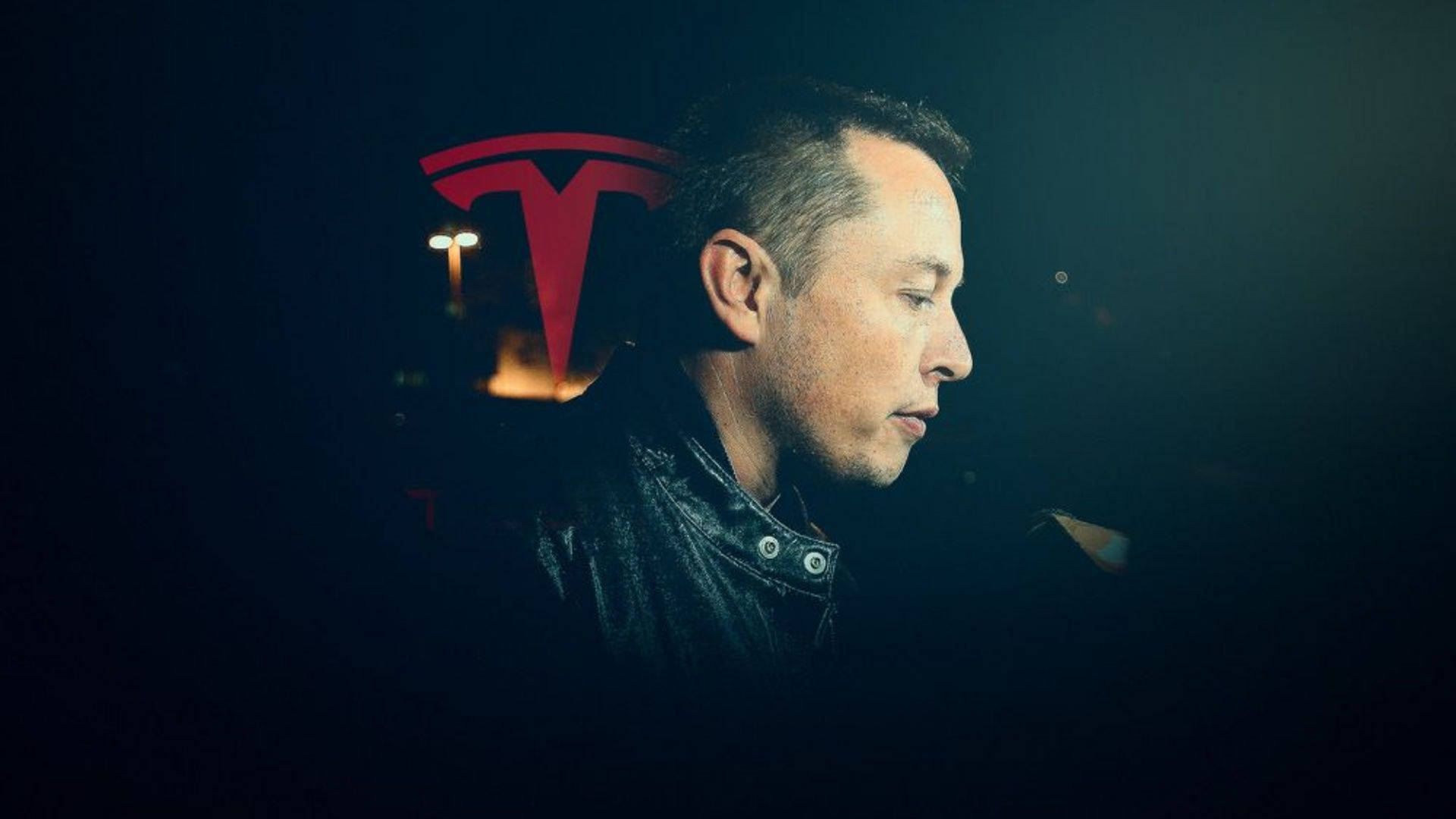 Elon Musk, CEO of Tesla and SpaceX, in profile view against a dark background with a subtle Tesla logo
