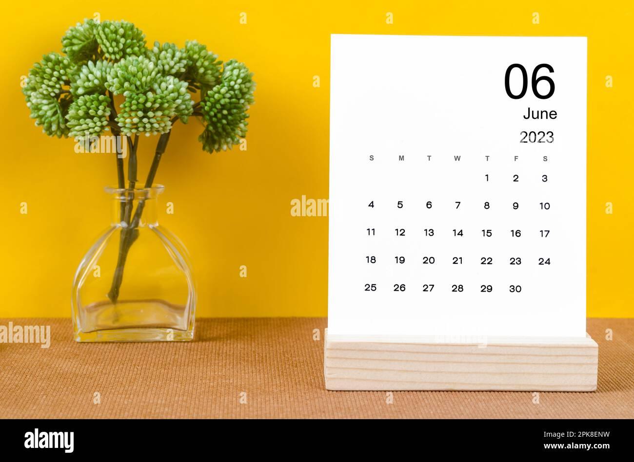 June 2023 Monthly desk calendar for 2023 year on yellow background