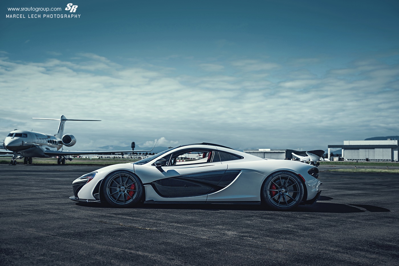 Awesome White Mclaren P1 Race Mode Side Jet Background
