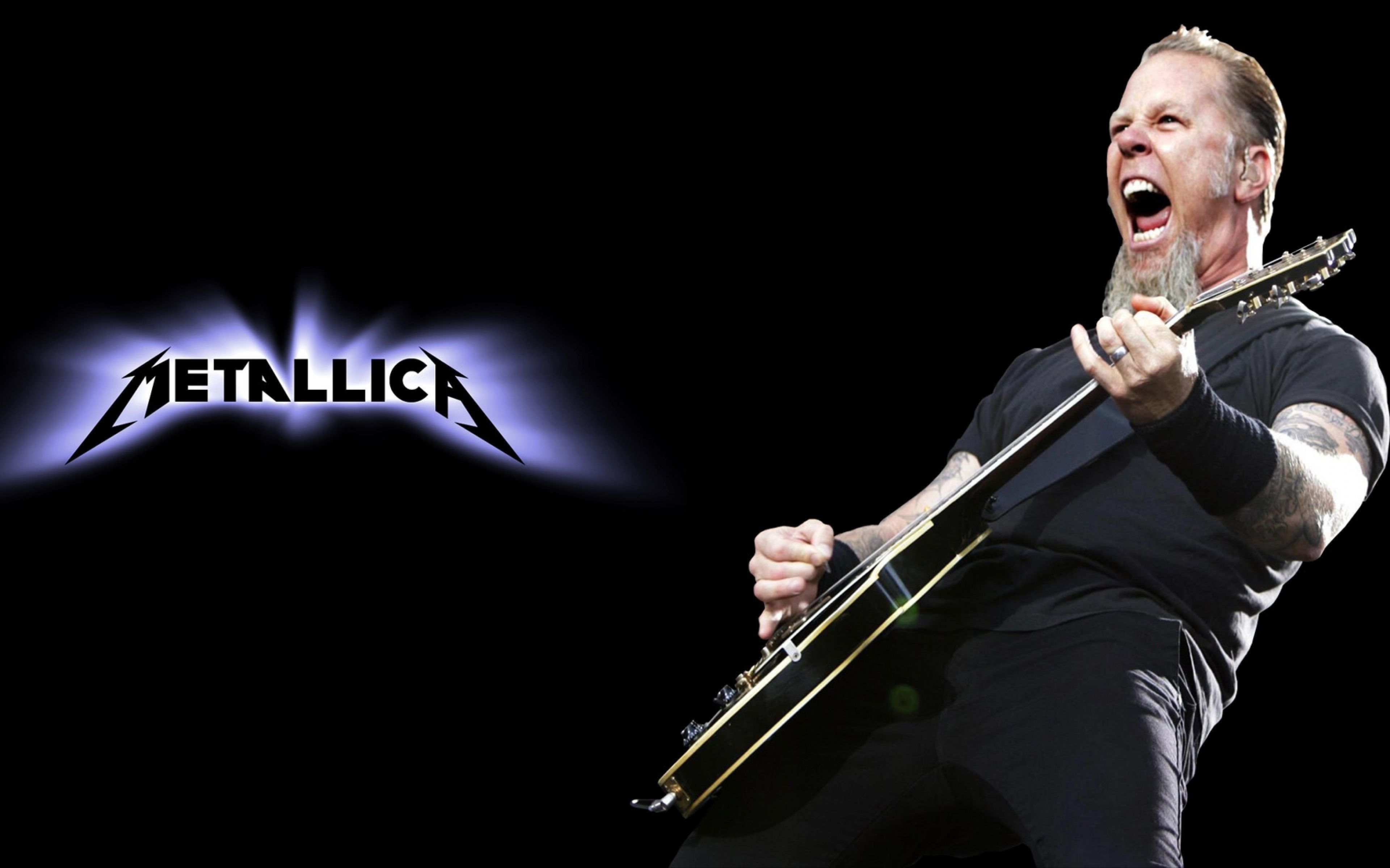 James Hetfield of Metallica performing live on stage with his guitar, image suitable for Metallica backgrounds