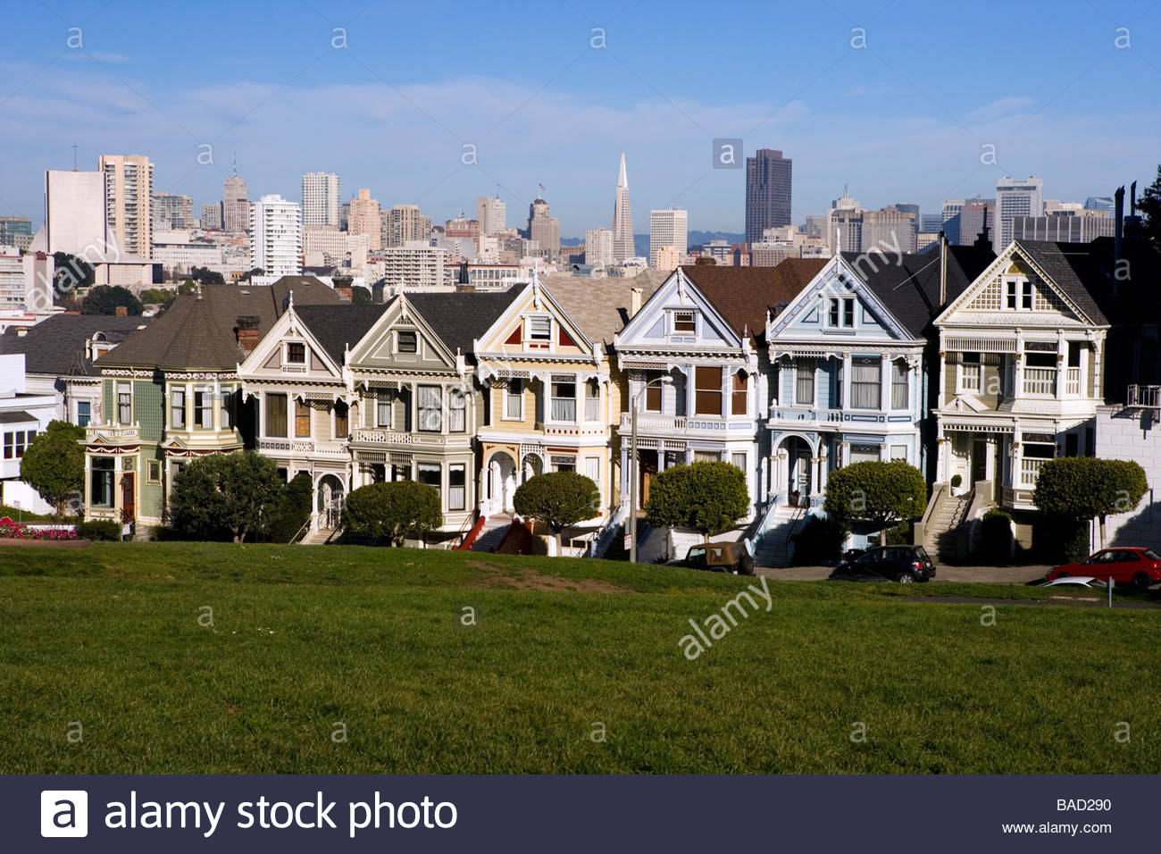 Victorian Houses On Alamo Square With City Skyline In Background