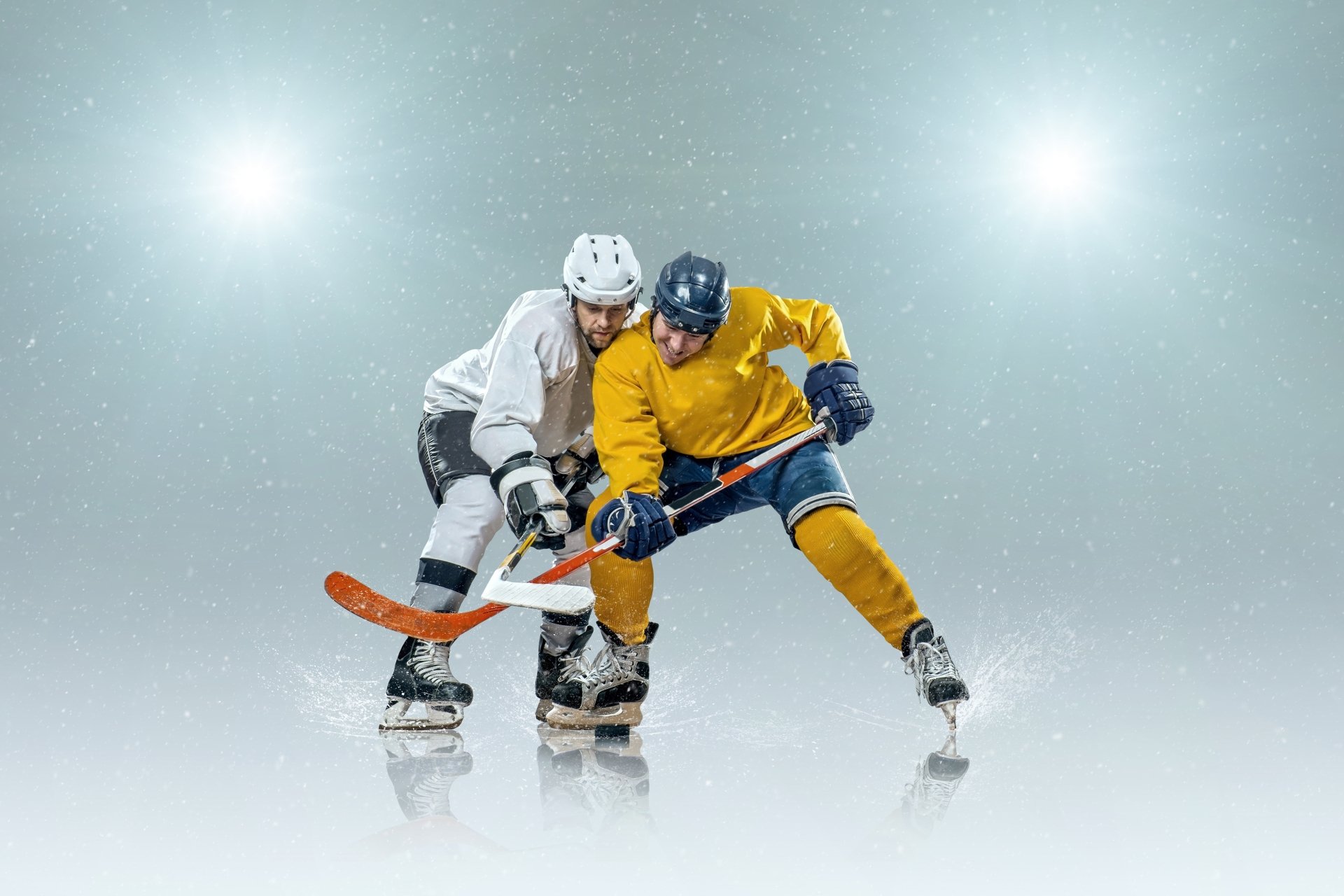 Two ice hockey players competing for the puck during a fast-paced match, showcasing the intensity and skill of the sport