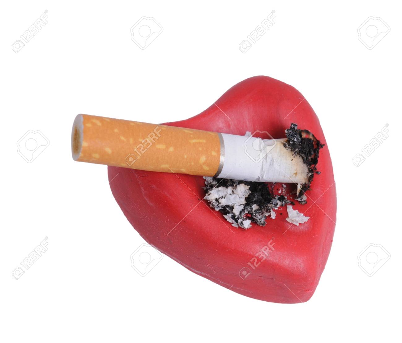 Cigaret Stub In Heart Isolated On A White Background Stock Photo