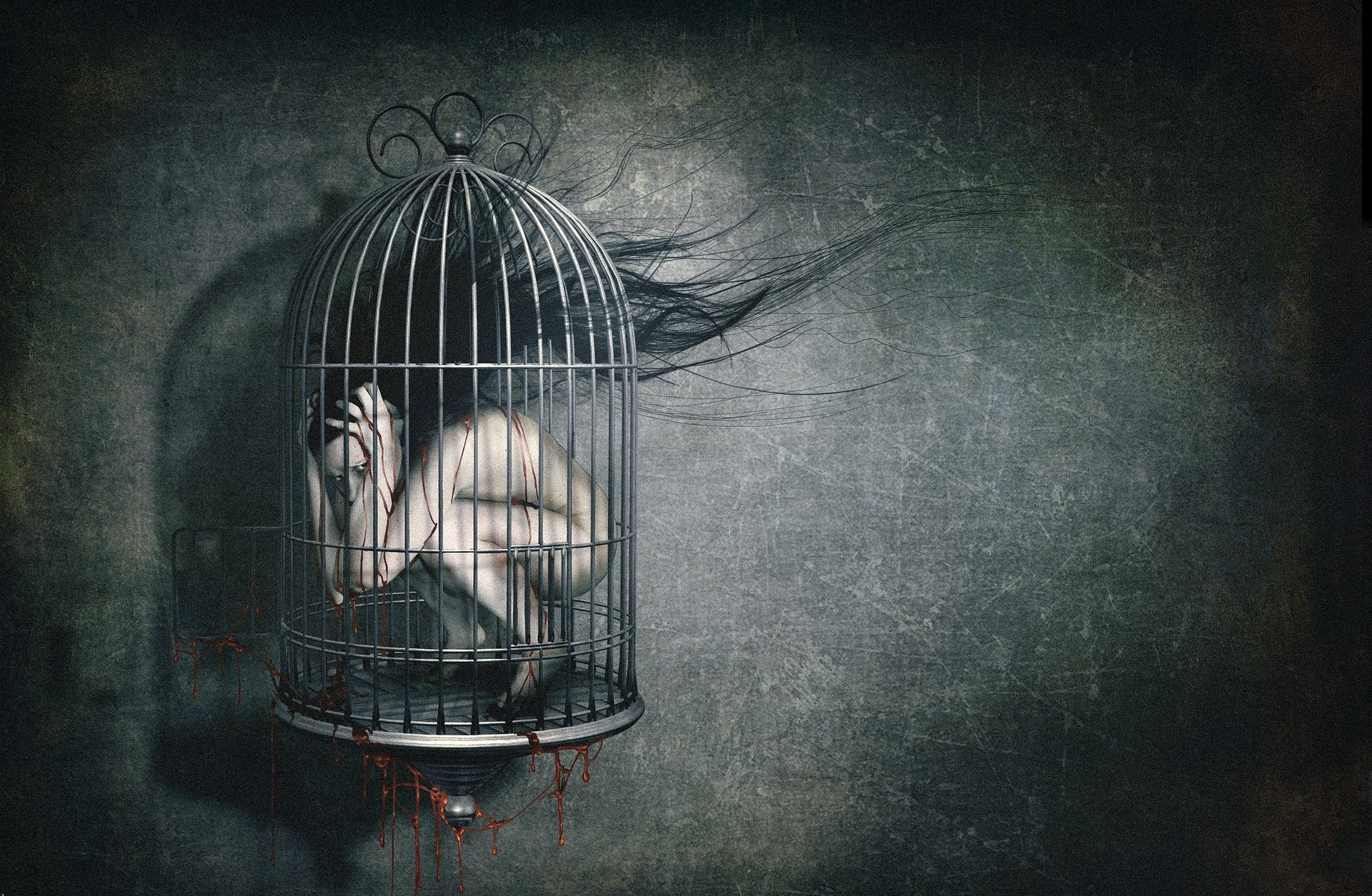 A grayscale image of a person curled up inside a birdcage, symbolizing depression, confinement, and emotional distress
