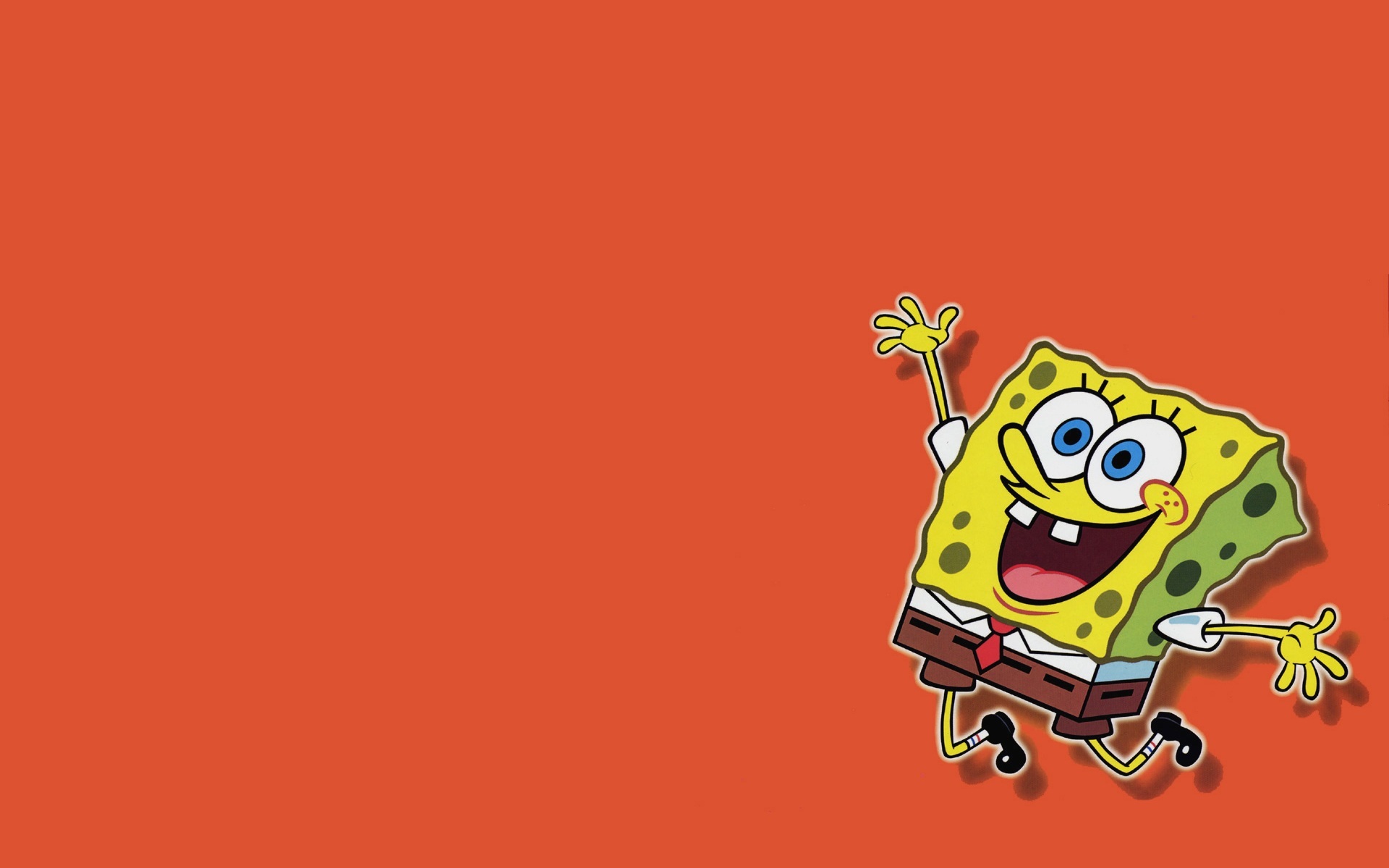 Spongebob Squarepants jumping with joy on a vibrant orange background