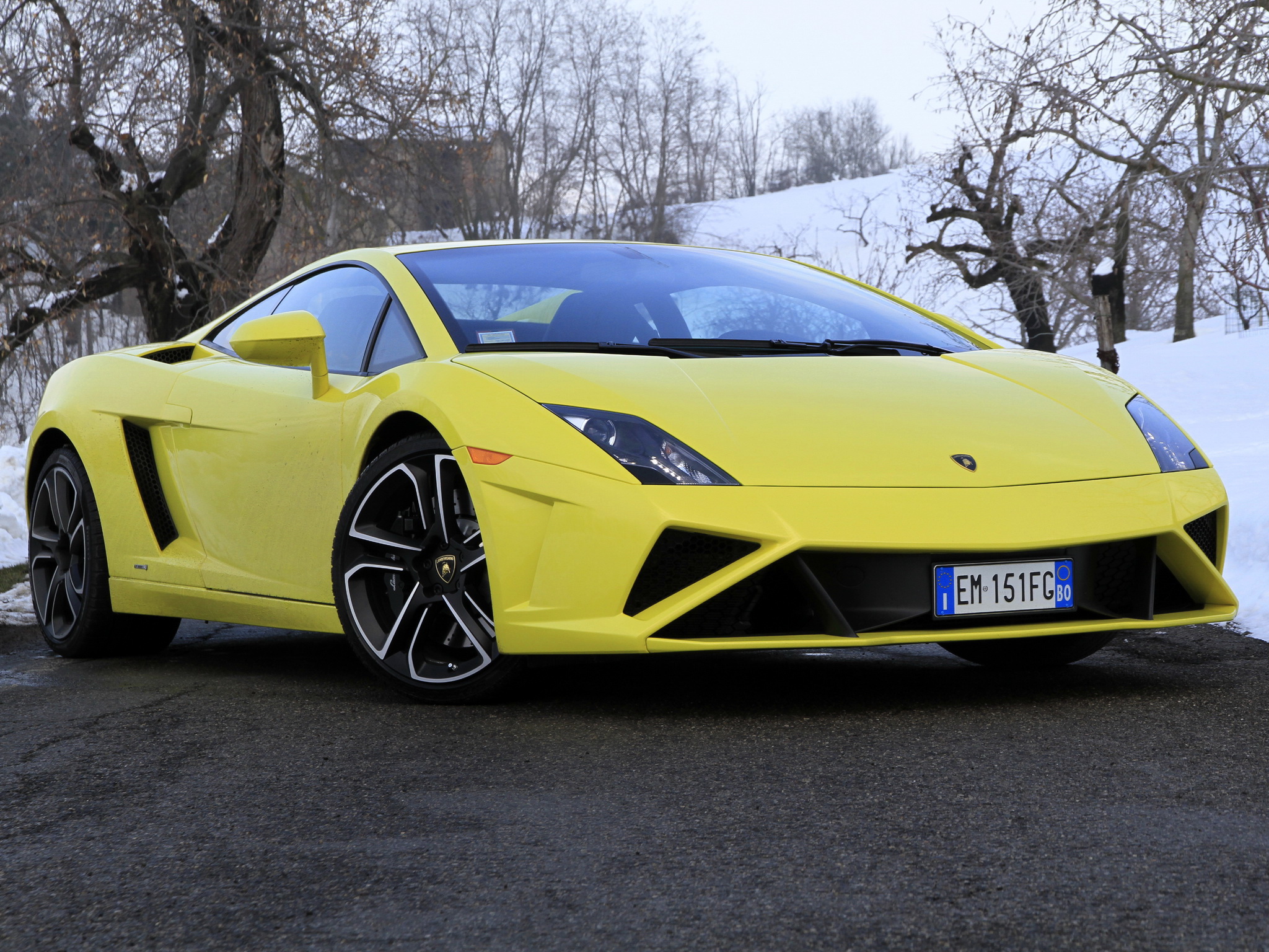 Bright Yellow Lamborghini Gallardo parked on a winter road
