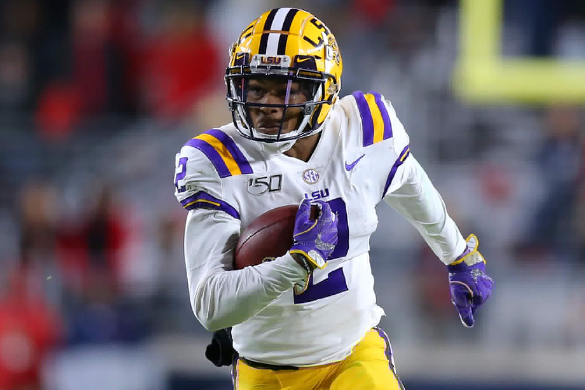 Justin Jefferson of the LSU Tigers running with the football during a college football game