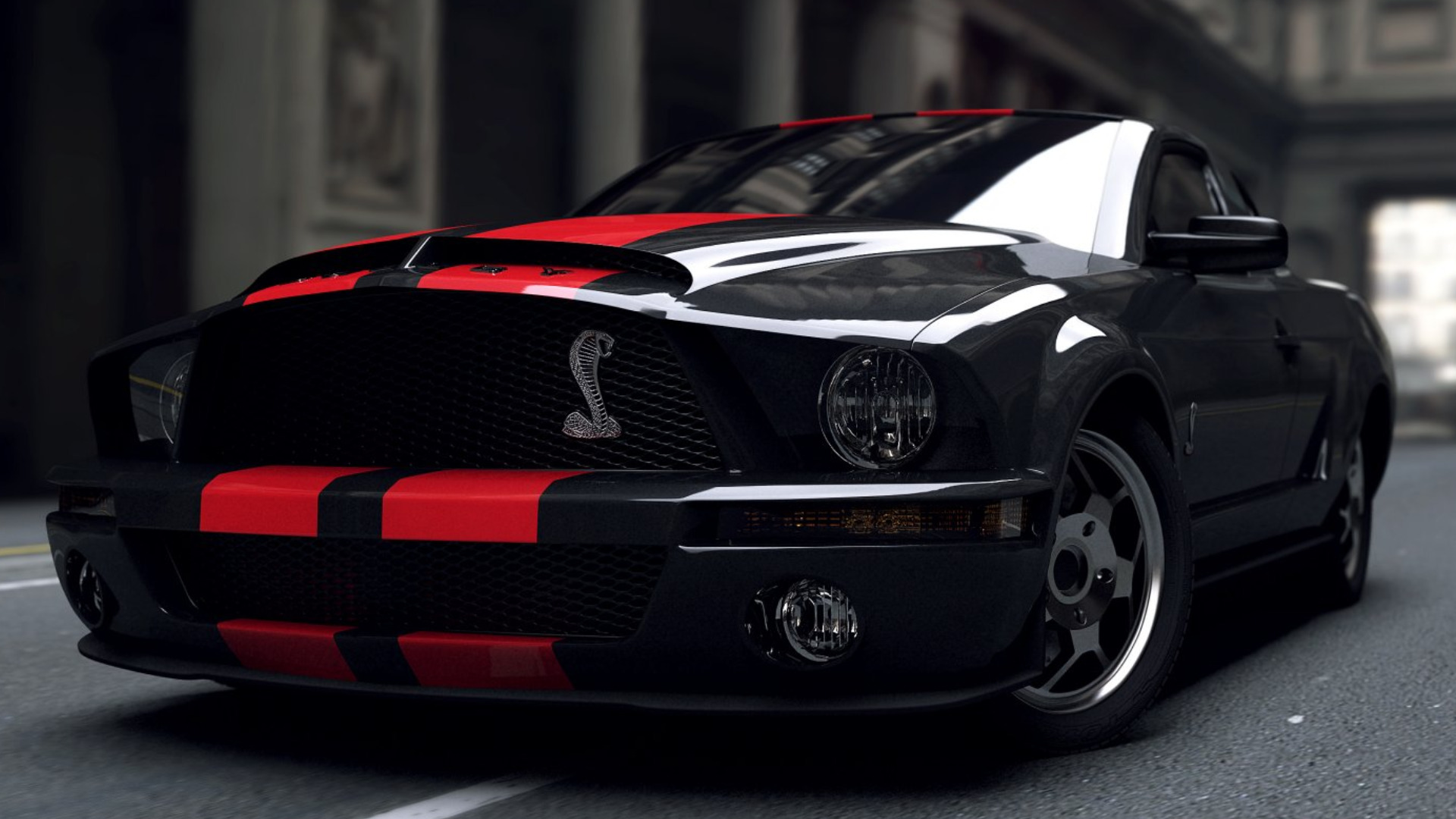 A sleek black Ford Mustang Shelby GT500 with red racing stripes parked on a city street