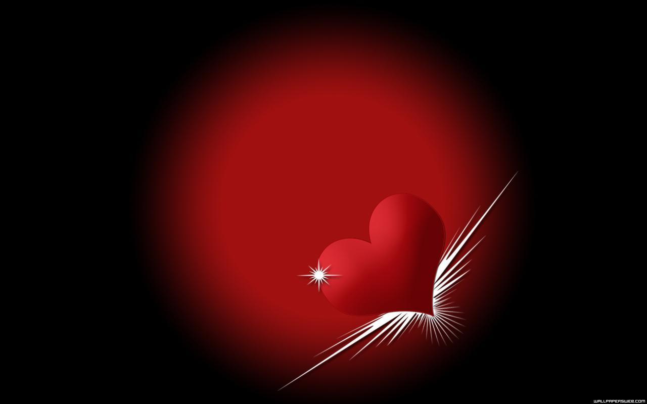 A vibrant red heart on a dark background, symbolizing love and passion