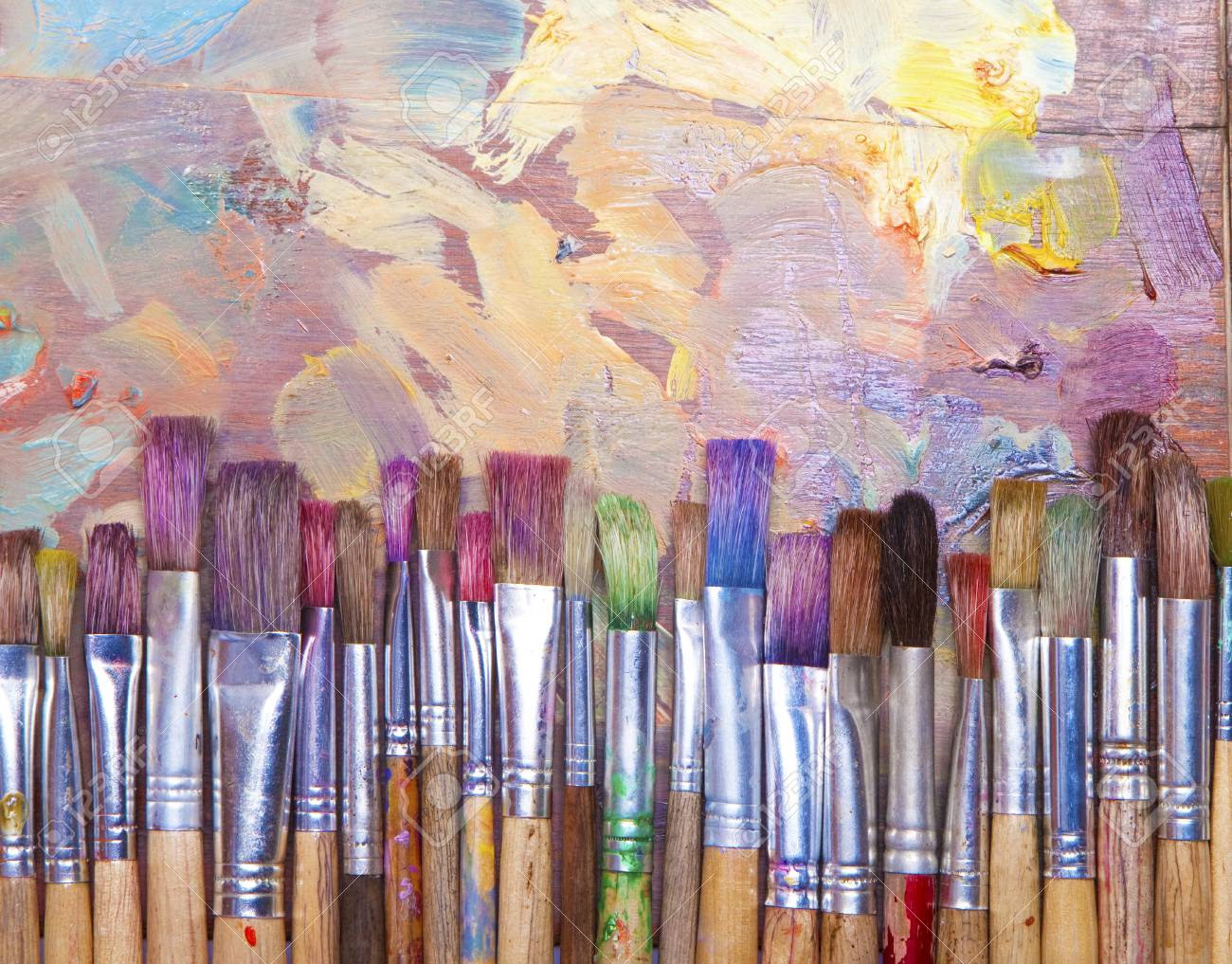 Used Artists Paint Brushes Different Colors On Palette Background