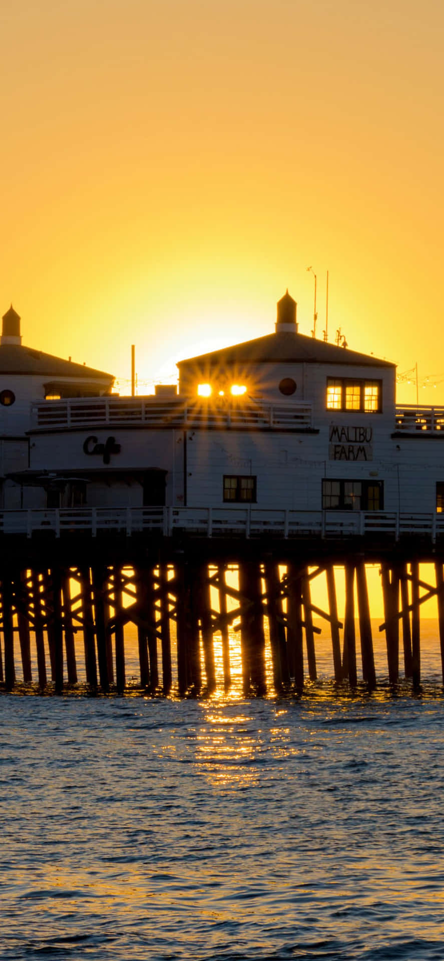 iPhone Xs Max Malibu Sun Rising At The Docks Background Wallpaper