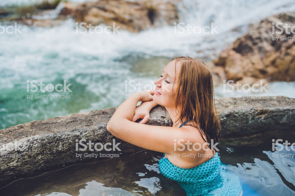 Geothermal Spa Woman Relaxing In Hot Spring Pool Against The