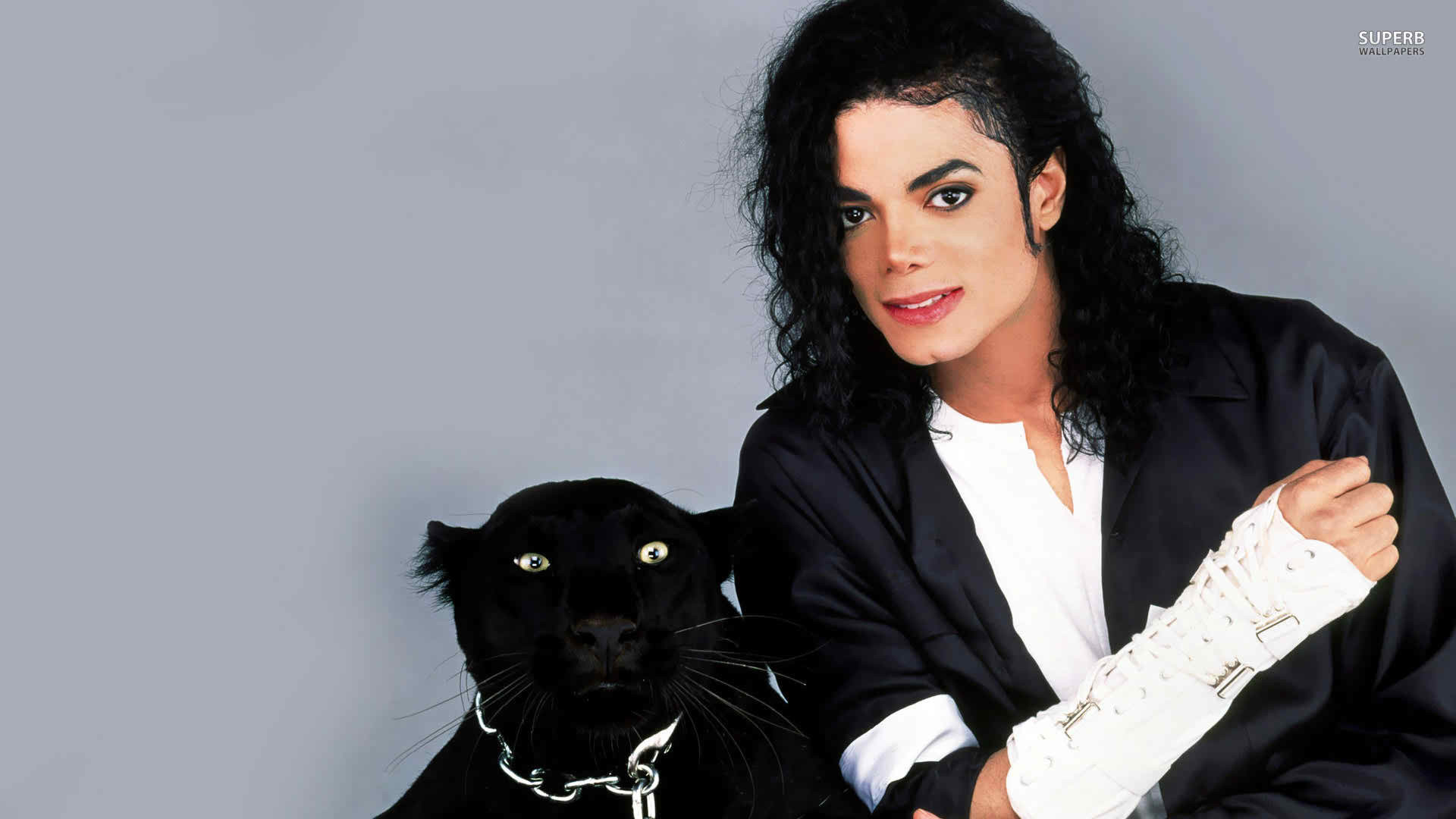 Michael Jackson posing with a black panther