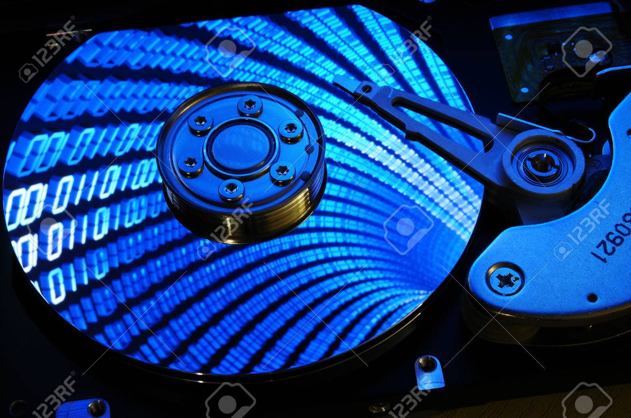 Close Up Of Puter Hard Drive Disc With Binary Effects Reflected