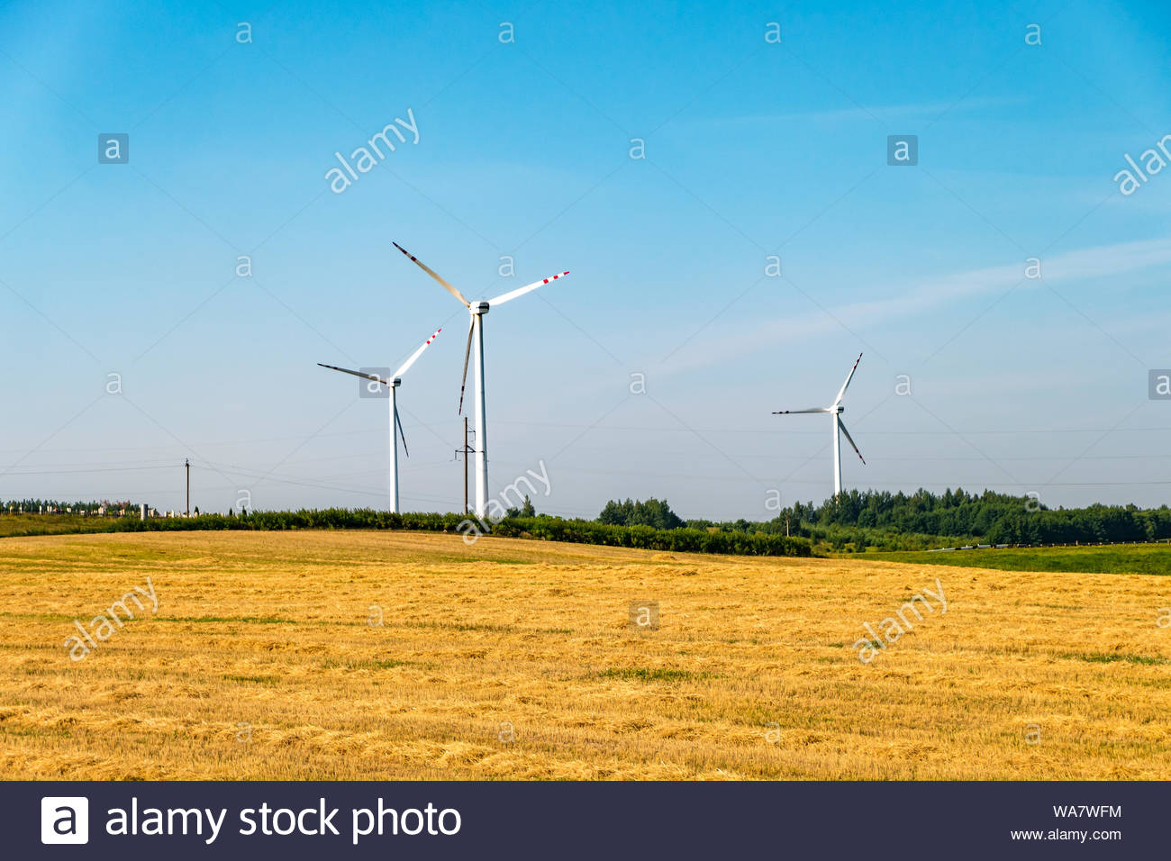 Rotating Blades Of A Windmill Propeller On Blue Sky Background