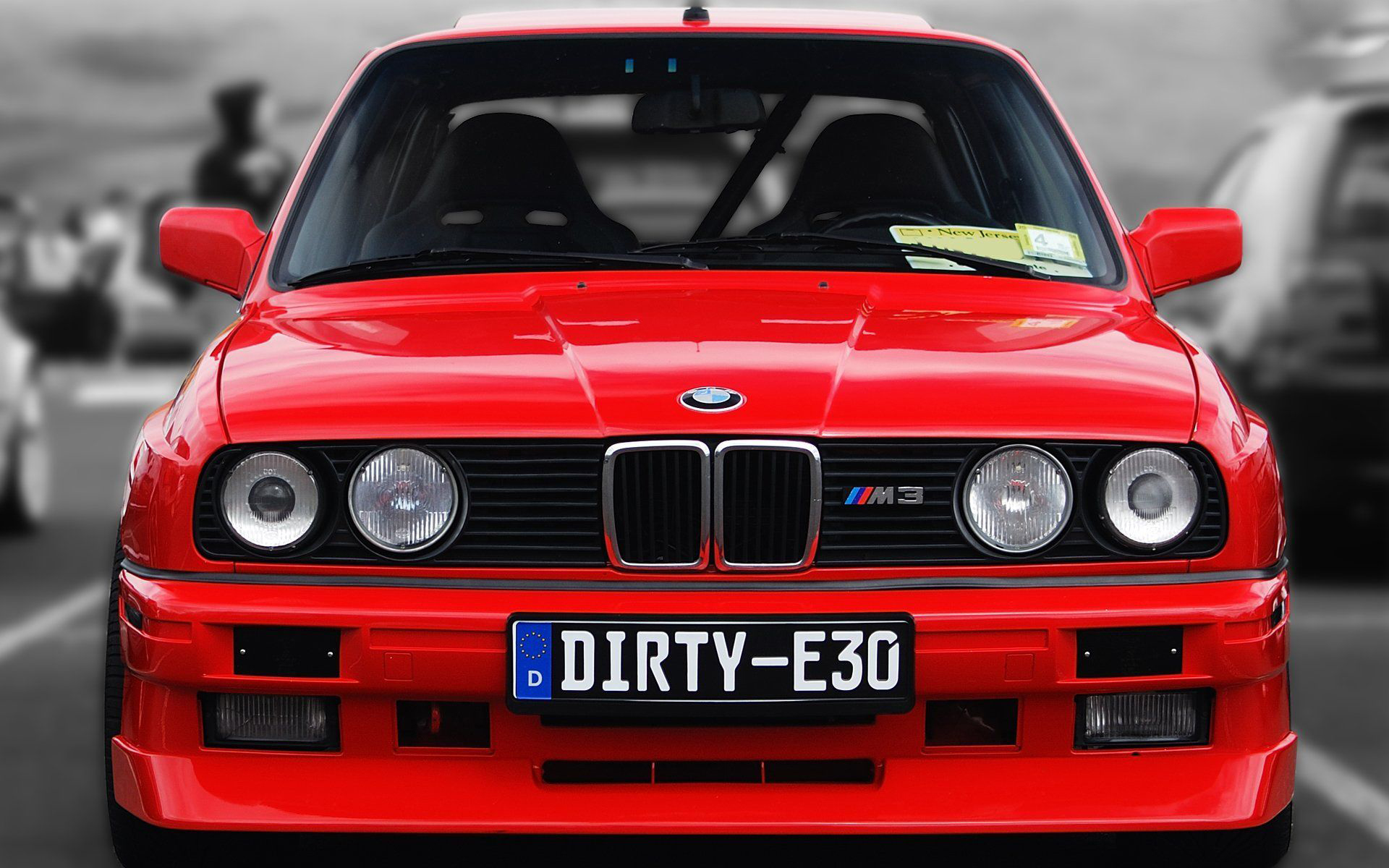 Red BMW E30 M3 parked, front view