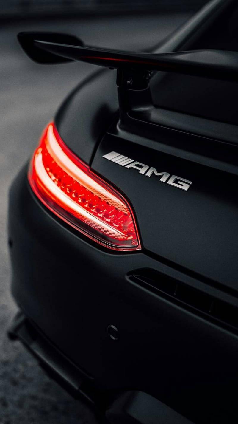Caption Black Amg With Glowing Red Tail Lights Wallpaper