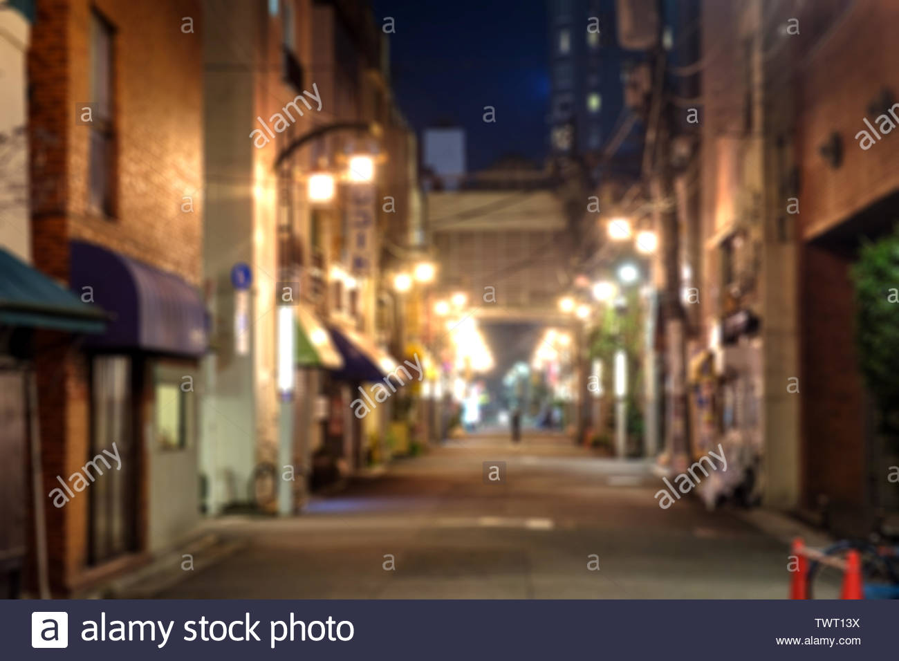 Blurred Scene Of Alleyway With Light Glowing At Night Background