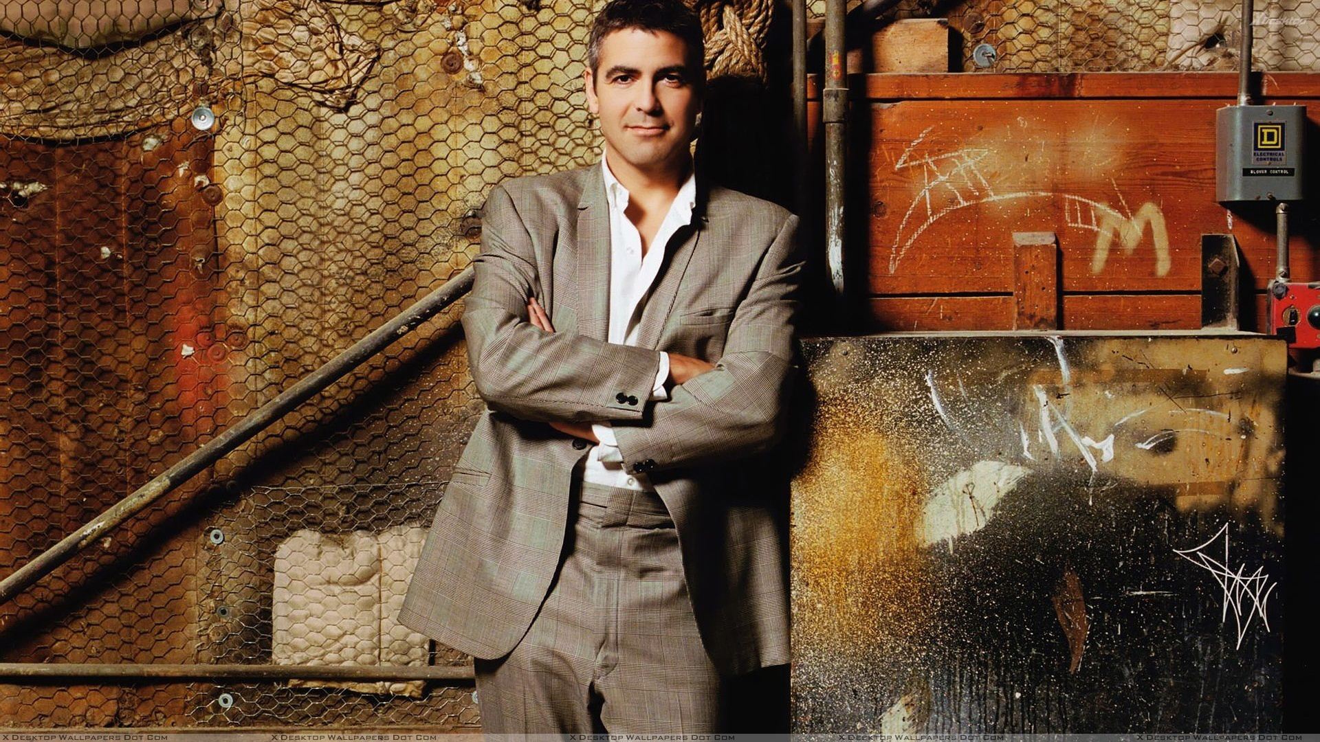 George Clooney In Coat Smiling Modeling Pose Wallpaper