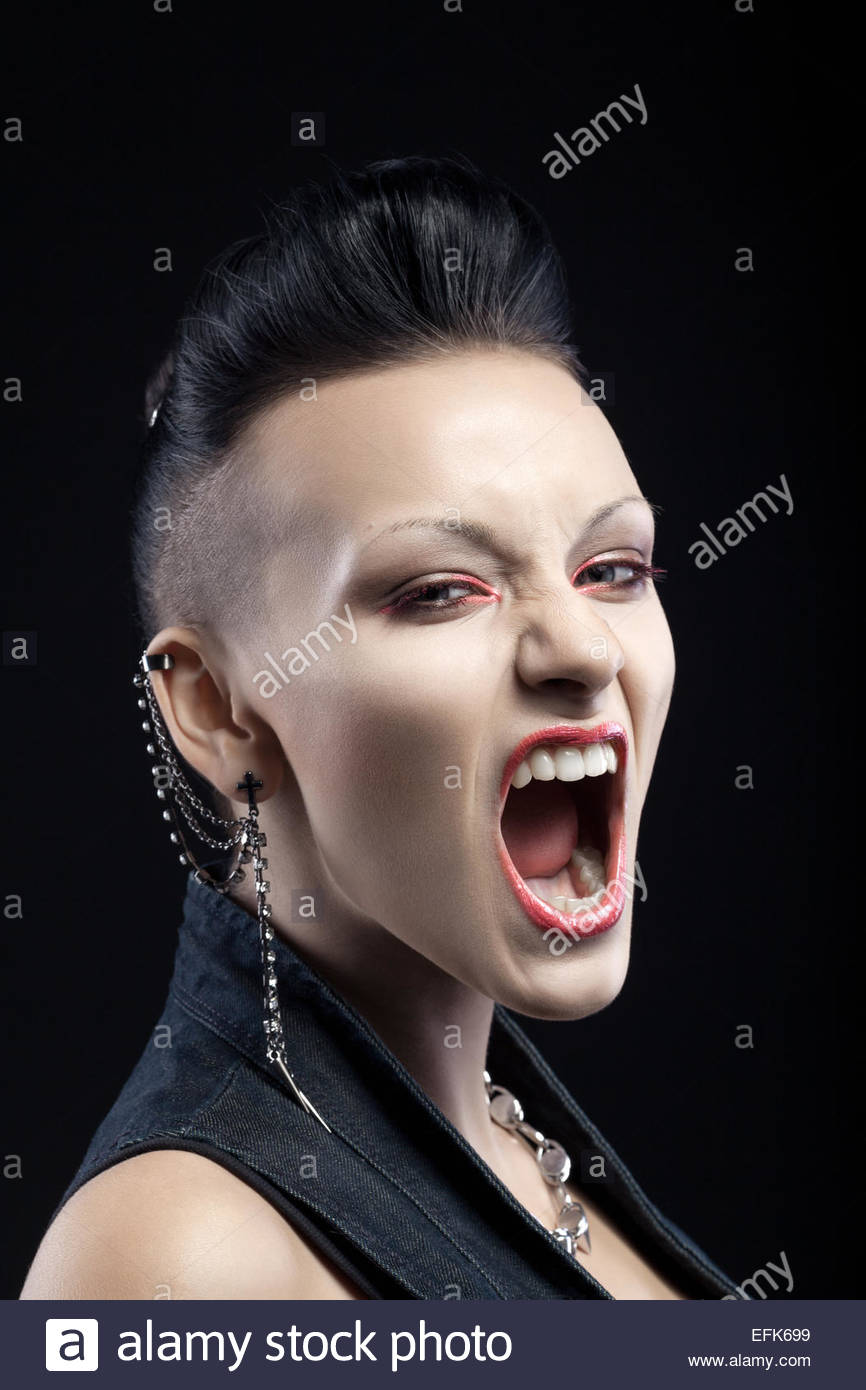 Portrait Of Angry Young Woman Screaming Isolated On Black