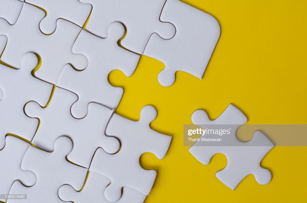 White Jigsaw Puzzle On Yellow Color Background Stock Photo Getty